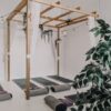 brown wooden framed canopy above yoga mat